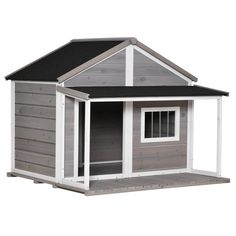 a gray and white dog house with a black roof