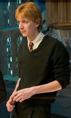 a young man in a harry potter costume