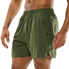 a man wearing green shorts and no shirt