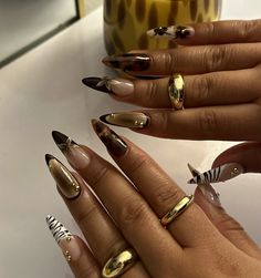 Unleash your wild side with this bold nail design featuring a stunning mix of tortoiseshell patterns, zebra stripes, and gold embellishments. Perfect for those who love a luxurious and edgy look, this manicure is ideal for making a statement. Get inspired by this unique and fierce nail art! 🐆💅✨ #AnimalPrintNails #TortoiseshellNails #BoldNailArt #GoldNails #NailTrends2024 #StatementNails #ZebraNails #LuxuryNails #EdgyNails #NailInspo #NailGoals Black And White Gold Nails, Autumnal Nails 2024, Do Nails With Me, Streetwear Nails Designs, Ucla Nails, Word Nail Art, Mix Match Nail Designs, Complicated Nail Designs, Tiger Nails Designs