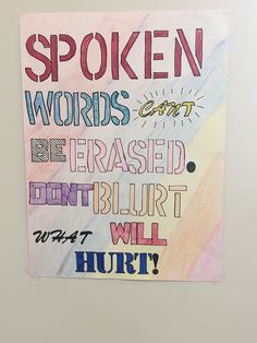 a poster with words written on it in different colors and styles, hanging on a wall