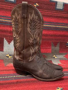 "From Blackbird Vintage of Sedona, Arizona  This is a beautiful pair of brown leather Vintage Cowboy Western boots. Marked a Mens size 8.5 (Should fit a ladies size 10 or a ladies wide 9.5. ) Made in USA By \"Dan Post.\" Condition Notes: -Broken in pre-owned condition with normal signs of wear such as scuffing, soiling, nicks, spots and creasing  -Wear to soles and heels Measurements: 14\" high, including a 1 5/8\" heel Heel to toe: 11 3/8\" Width across bottom of sole: 3 5/8\" Since this is a v Rustic Snip Toe Winter Boots, Fitted Vintage Brown Snip Toe Boots, Brown Pointed Toe Boots For Western-themed Events, Rugged Brown Wide Calf Boots, Rugged Wide Calf Brown Boots, Rustic Brown Boots With Leather Sole, Fitted Brown Boots For Western-themed Events, Vintage Brown Snip Toe Boots For Fall, Brown Pointed Toe Boots For Rodeo