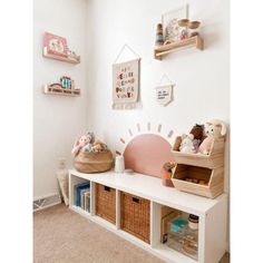 a white room with shelves and stuffed animals