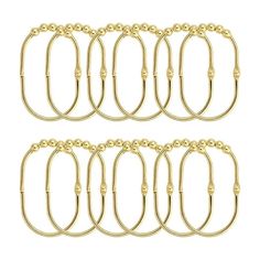 six pairs of gold plated metal rings with loops on each side and an oval link at the end