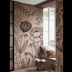 a room with flowers painted on the wall and window sill in front of it