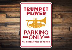 a sign that says trumpet player parking only all others will be towed