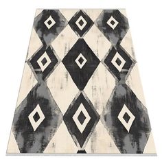 a black and white area rug with an abstract design on the bottom, in front of a white background