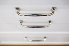 a close up of a metal handle on a drawer