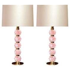 pair of pink crystal lamps with gold base and white linen shades on each lamp shade