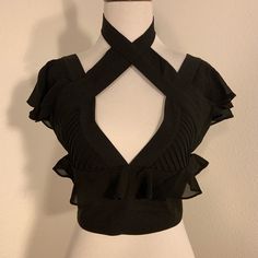 Nwot Nasty Gal Black Cropped Blouse Top Size: X-Small Material Content: 97% Polyester 3% Spandex *Nwot *Flutter Layered Sleeve *Deep V-Neck With Pleated Sides *Ruffle Around Bust Line *Criss Cross At Chest With Chocker At Neck *Full Back Zipper (Exposed) In New Without Tag Condition And In Original Packaging. Thanks So Much For Looking! Elegant Short Sleeve Crop Top For Party, Elegant Short Sleeve Party Crop Top, Fitted V-neck Crop Top For Going Out, Chic Evening Crop Top With V-neck, Fitted V-neck Crop Top For Date Night, Chic Evening V-neck Crop Top, Black Cropped Top For Formal Occasions, Elegant Crop Top Blouse For Evening, Edgy Tops For Summer Evenings