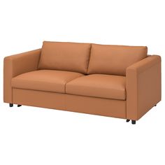 a tan leather couch sitting on top of a white floor