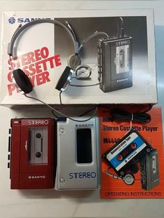 there is a stereo cassette player and headphones in the box next to each other