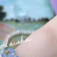 a woman's hand with a bracelet on it that says, goddasha