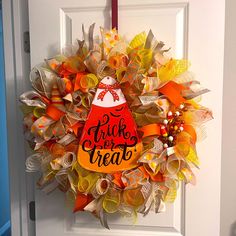 a wreath that says trick or treat on it