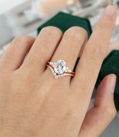 a woman's hand with a diamond ring on it