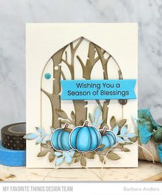 a card with blue pumpkins on it and a ribbon tied around the edge that says wishing you a season of blessing