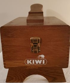 This is a vintage Kiwi shoe shine box.  Inside the box, there are signs od use - a circle from shoe polish, various stains. See photos. There are two Kiwi brushes, and these are stained on the wood and on the bristles. There is a small brush, a Kiwi buffer sponge, a Mr Shine box with two unused shine pads, and six tins of polish.  Two are Kiwi, two are Esquire, one Griffin, and one Cavalier boot creme. I have not opened the tins; they feel light. I have no idea what is original to the kit. These Cavalier Boots, Shoe Shine Box, Inside The Box, A Circle, Stain