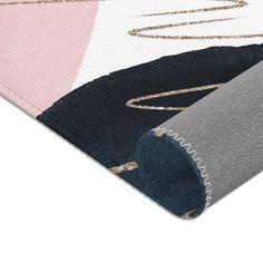 two rugs with different colors and designs on the top one is pink, white, blue