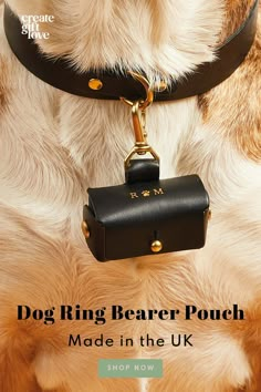 a dog wearing a black leather leash with the words dog ring bearer pouch made in the uk