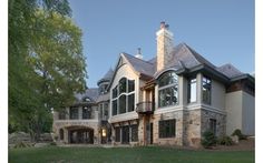 a large house with lots of windows in the front