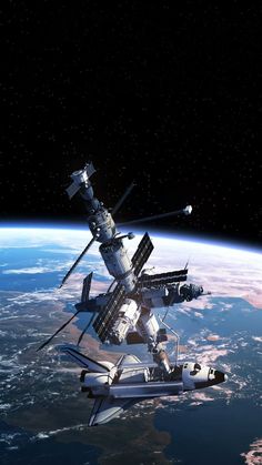 an artist's rendering of the space station in orbit, with earth in the background