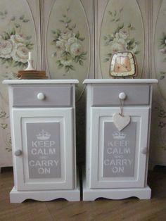 two white nightstands sitting next to each other