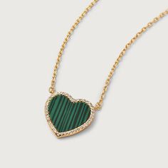 This modern love malachite heart necklace is 18k gold plated for a luxurious touch. Its striking design features a heart-shaped malachite stone, prized for its healing properties. Express your love and enhance your well-being with this elegant necklace. Pendant Height: 12mmPendant Width: 9.7mm Malachite Jewelry, Gold Vermeil Jewelry, Stacked Earrings, Malachite Stone, Elegant Necklace, Silver Heart Necklace, Modern Love, Charm Rings, Engraved Necklace