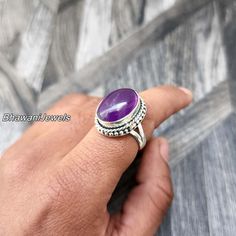 BhawaniJewelsAndGems Purple Amethyst Natural Ring, Sterling Silver Ring for Women, Statement Ring with Stone, Gemstone Boho Ring, Bohemian Jewelry Ring Style -> Band / Boho & Hippie Metal -> 925 Sterling Silver Ring Size - > All Sizes Are Available > Gift For Mom, Mother's Day Gift Ring A spinner ring, also known as a fidget ring or meditation ring, is a type of ring that features one or more outer bands that can rotate around the inner band of the ring. The outer bands may be made of a different material or have a different texture from the inner band, allowing for tactile stimulation and sensory feedback. Spinner rings are often used as a stress-relieving tool, as the repetitive motion of spinning the outer band can help to calm the mind and reduce anxiety. Some people also find spinner Bohemian Rings With Gemstone Accents For Anniversary, Bohemian Adjustable Crystal Ring With Gemstone Accents, Bohemian Amethyst Ring With Gemstone Accents As Gift, Bohemian Crystal Ring With Gemstone Accents As Gift, Bohemian Anniversary Rings With Gemstone Accents, Bohemian Oval Jewelry With Accent Stones, Bohemian Silver Amethyst Ring, Bohemian Amethyst Ring Gift, Bohemian Sterling Silver Purple Rings