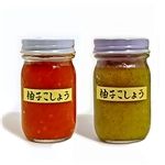 two jars filled with different kinds of sauce