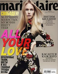 a magazine cover with a beautiful blonde woman in floral print dress on the front page