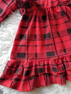 Shipping in about 5-7 business days! Need sooner purchase rush fee listing in my Etsy shop Running True to Size Listing is for dress only! Matching Suspender skirt and baby romper available in my Etsy Shop Looking for the cutest holiday dress ever!! You POP found it. This is a bright red and black plaid ruffled dress. This has cute double ruffles on the bottom of the dress and double ruffles on the sleeves. The fabric is 100% cotton so its a soft stretchy dress. The sleeves have a cute black cro Plaid Christmas Holiday Dress, Fitted Plaid Holiday Dress, Fitted Plaid Dress For Holiday, Plaid Dresses For Fall Party, Cute Red Holiday Dresses, Cute Red Holiday Dress, Plaid Dress For Christmas Holiday, Fall Gingham Plaid Dress With Ruffles, Plaid Dress For Fall Party