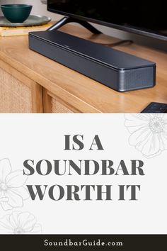 the soundbar worth it is on top of a wooden table with a bowl and cup