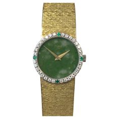 Circa 1970s Ladies Piaget Wrist Watch, 24 M.M. 18K Yellow Gold 2 piece case, Diamond and Emerald set Bezel, 17 jewel mechanical, manual wind movement. Jadite stone dial. 5/8 inch wide soft flexible textured bracelet, watch length 6 1/2 inches. Recently serviced and comes with a one year warranty. Piaget Ring, Emerald Set, Textured Bracelet, Wind Movement, Manor House, Girls Best Friend, Gold Watch, Time Piece, 2 Piece