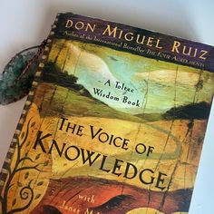 the voice of knowledge by don miguel rutz is displayed on a white table top