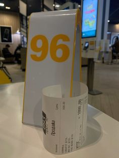 a roll of paper sitting on top of a table next to a sign that says 99