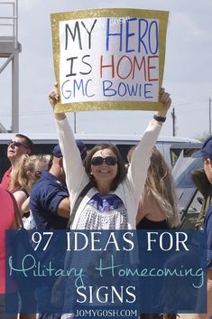 a woman holding up a sign that says, my hero is home gmc bowle