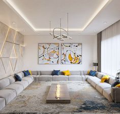 a modern living room with white couches and yellow pillows on the rugs,