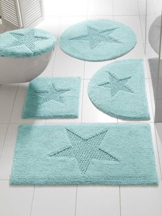 bathroom rugs with star designs on them in various sizes and colors, including blue