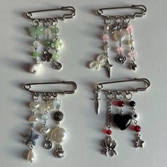 several different types of charms hanging from hooks