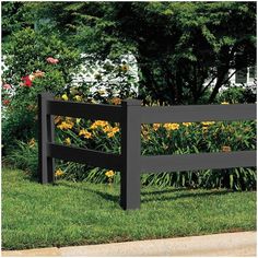 a wooden bench sitting on top of a lush green grass covered park area next to flowers