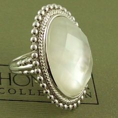 **********Final Sale - Price Is Firm*************** Honora Mother-Of-Pearl Oval Faceted Doublet Sterling Silver Ring. At The Center Of This Gorgeous Sterling Silver Ring Is A Bezel-Set Doublet Of Faceted Crystal Quartz And White Mother-Of-Pearl Framed By A Highly Polished Rope And Beaded Border. Finishing The Sophisticated Look Is A Decorative Beaded Design Along The Polished, Tapered Shank. *Ring Measures Approx. 1-1/4" Long X 1" Wide *Made In Italy White Oval Pearl Ring With Gemstone, White Oval Pearl Ring, Oval White Gold Pearl Ring, White Oval Pearl Ring Gift, White Oval Pearl Ring As A Gift, White Oval Pearl Drop Rings, Elegant Silver Oval Pearl Ring, White Oval Pearl Jewelry, Oval White Pearl Jewelry