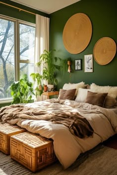 a large bed sitting next to a window in a room with two plants on the wall