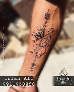 a man with a compass tattoo on his arm