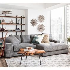 a living room filled with furniture and decor