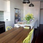 the kitchen is clean and ready to be used as a dining room or living room