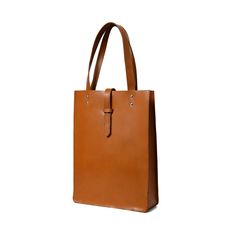 Embrace pure elegance with our artisan-crafted shopper tote. Woven from the very soul of buffalo leather, it doesn't just carry your belongings, but your style and confidence too. Its timeless brown shade, a silent nod to tradition, blends seamlessly with its contemporary design. Grasping the handles feels like shaking hands with timeless luxury. Revel in life's small moments of grandeur with every step, showcasing the world that you have an impeccable taste for both fashion and life's pleasures Timeless Cognac Shoulder Bag For Everyday, Timeless Brown Satchel With Double Handles, Timeless Smooth Grain Shoulder Bag For Shopping, Timeless Brown Shoulder Bag For Everyday, Timeless Brown Double Handle Satchel, Elegant Dark Tan Leather Shoulder Bag, Timeless Brown Everyday Shoulder Bag, Elegant Dark Tan Leather Bag, Chic Brown Smooth Grain Satchel