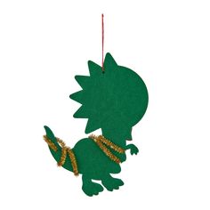 an ornament shaped like a green dinosaur with gold sequins on its tail