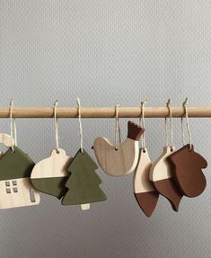 wooden ornaments hanging from a clothes line