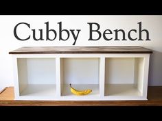 there is a shelf that has a banana on it and the words cubbie bench above it