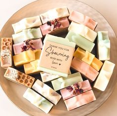 a plate full of soaps that say thank you for your wedding and will be served to guests